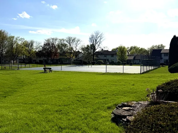 a view of outdoor space with garden and trees