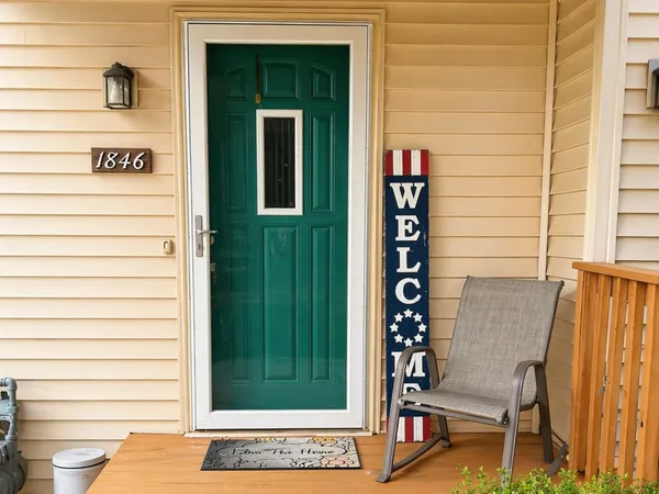 a view of front door with potted plant