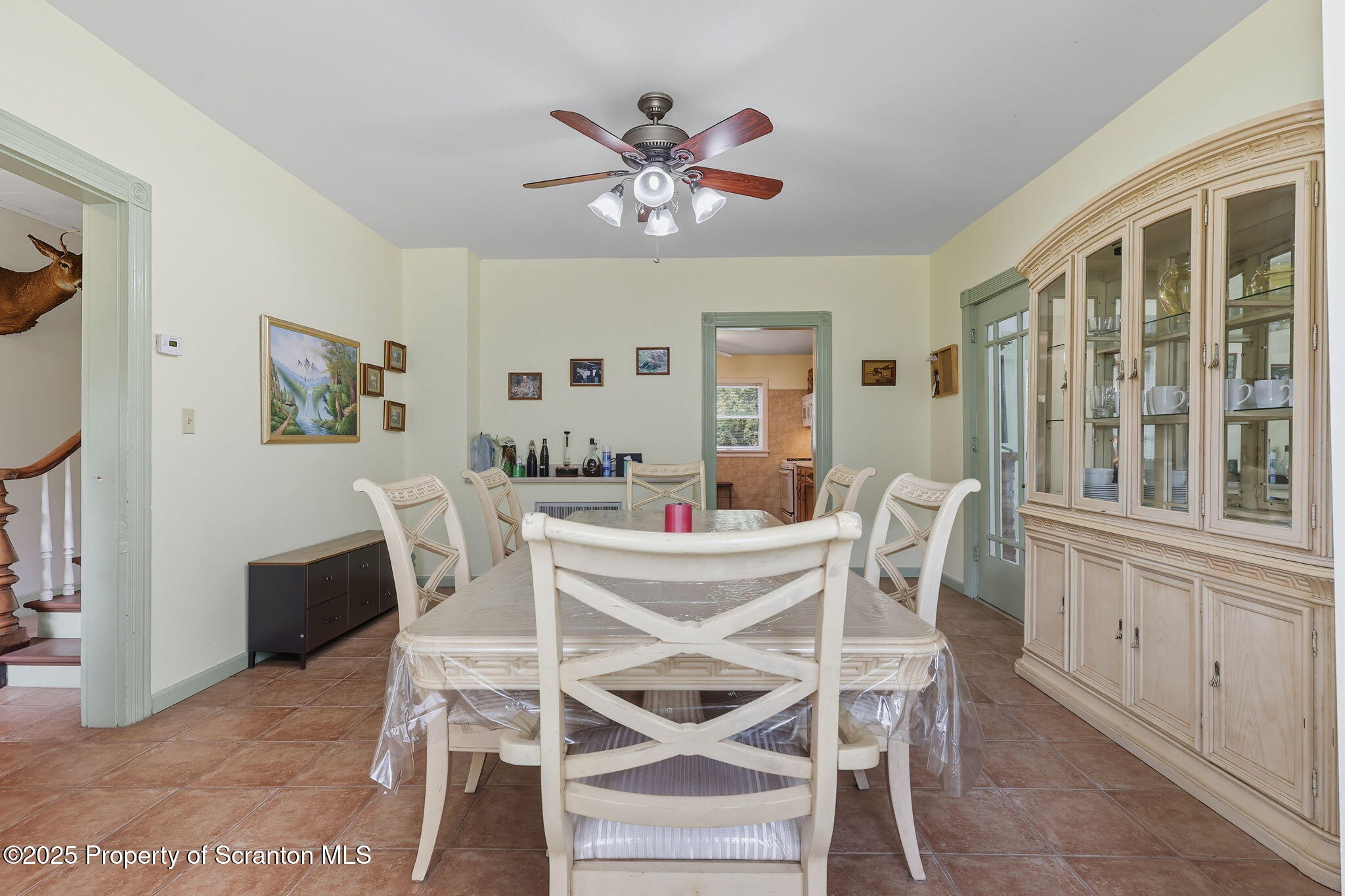 505 Creek Road Kingsley, PA 18826 - Photo 16 of 61 a view of a dining room with furniture and a chandelier