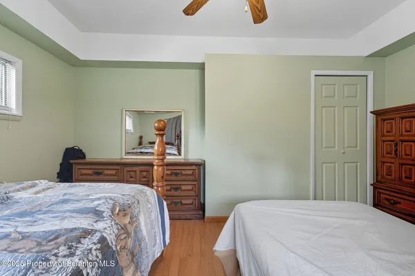 a bedroom with a bed and a dresser
