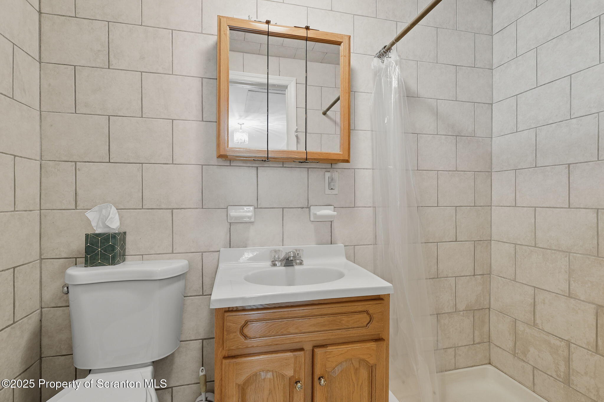 505 Creek Road Kingsley, PA 18826 - Photo 23 of 61 a bathroom with a sink toilet and shower