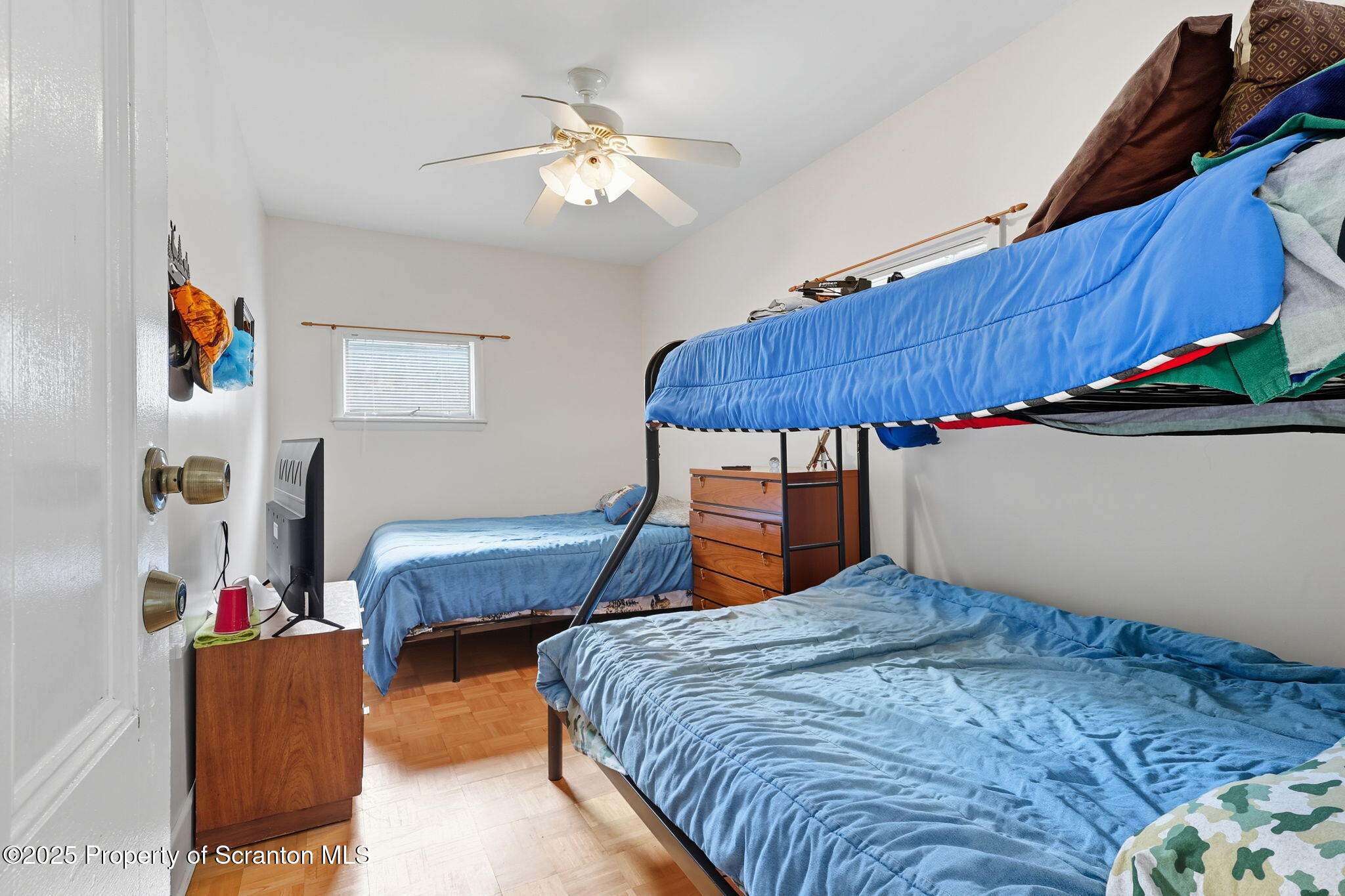 505 Creek Road Kingsley, PA 18826 - Photo 25 of 61 a bedroom with a bed and a lamp on dresser