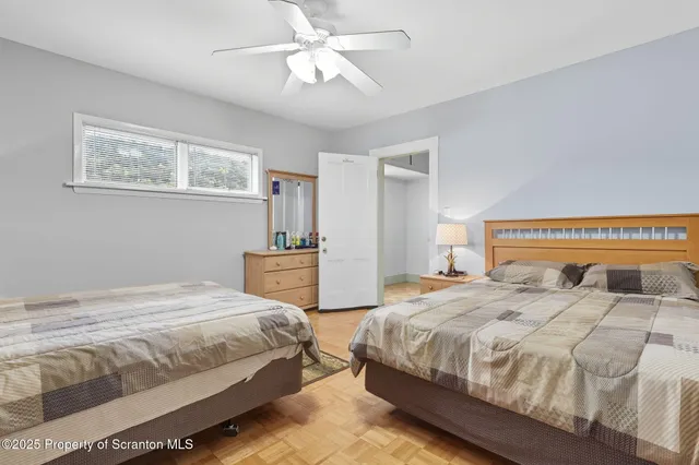 a bedroom with bed and window