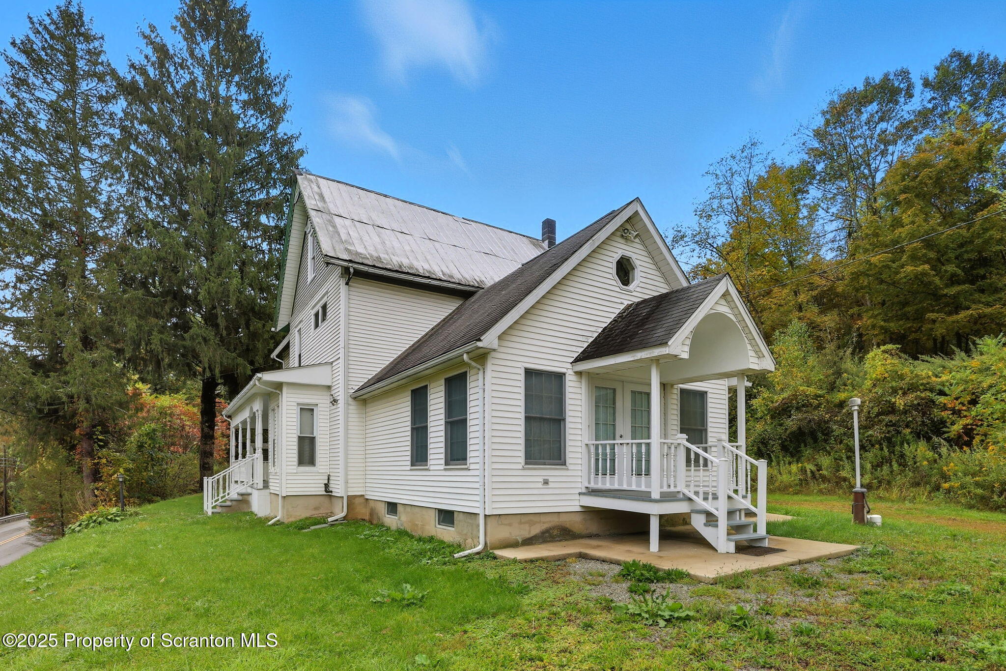 505 Creek Road Kingsley, PA 18826 - Photo 37 of 61 a front view of a house with a yard