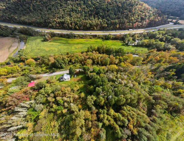 a view of an aerial view of residential houses with outdoor space