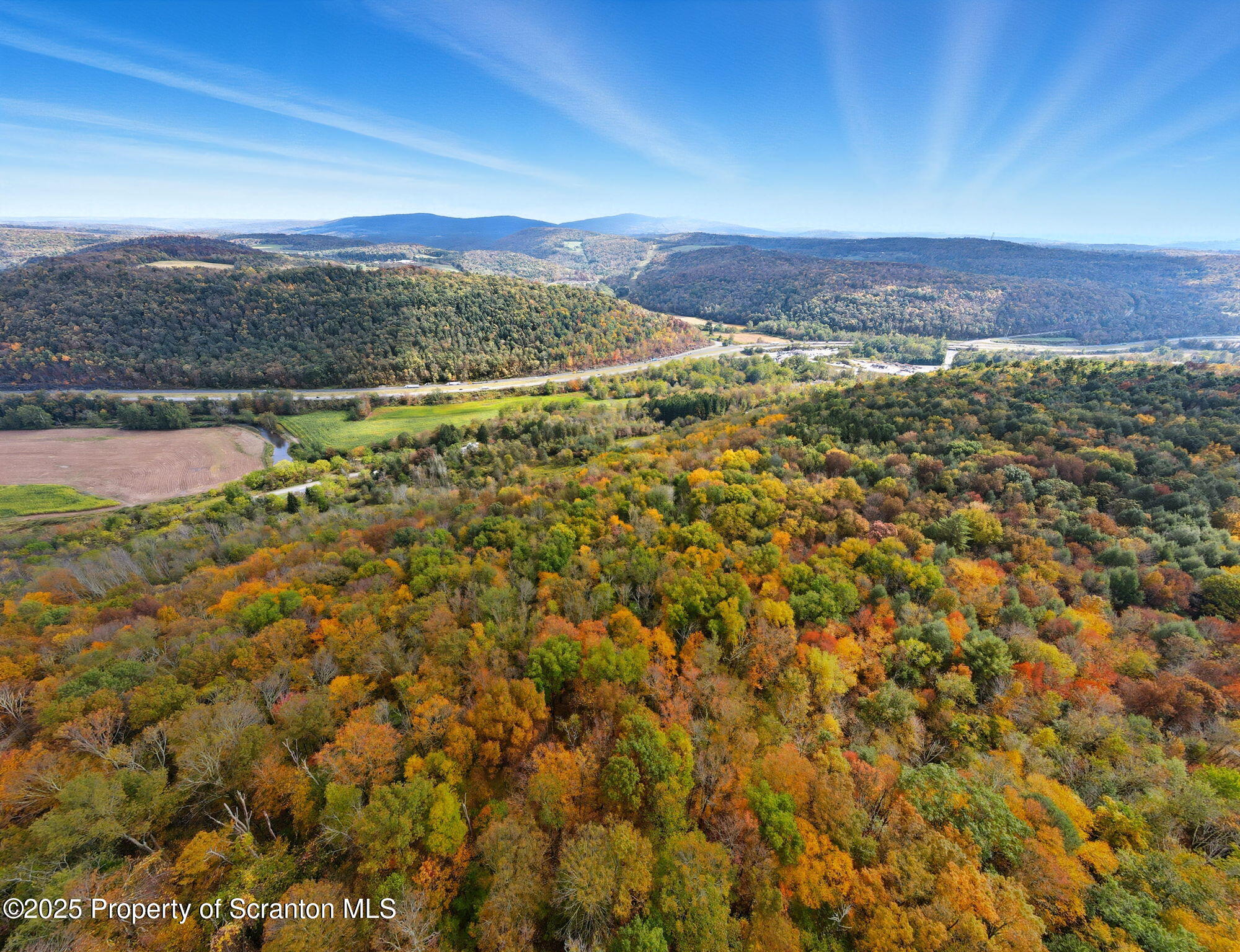505 Creek Road Kingsley, PA 18826 - Photo 50 of 61 a view of a city with mountains in the background