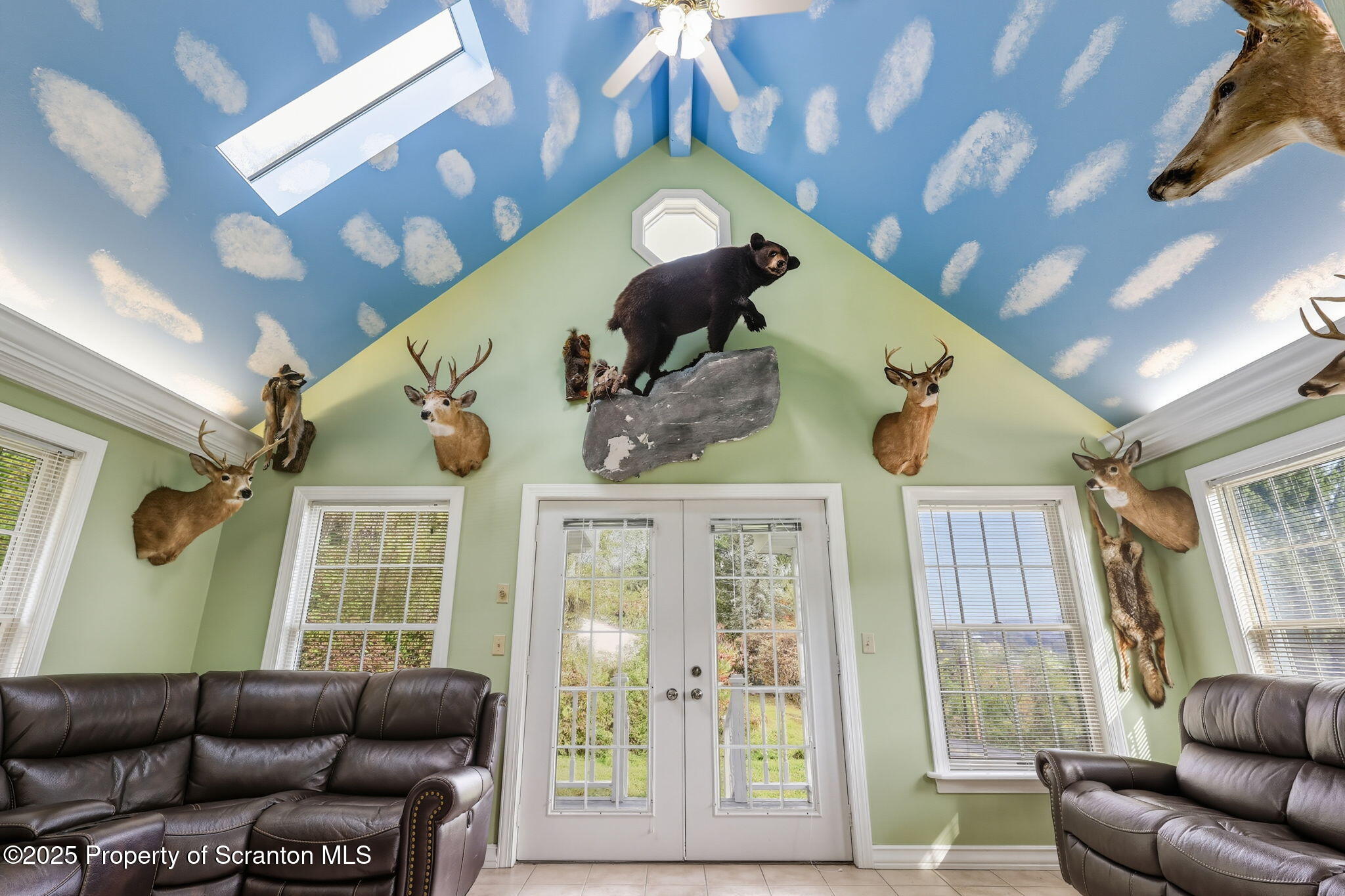 505 Creek Road Kingsley, PA 18826 - Photo 5 of 61 a living room with furniture and a large window