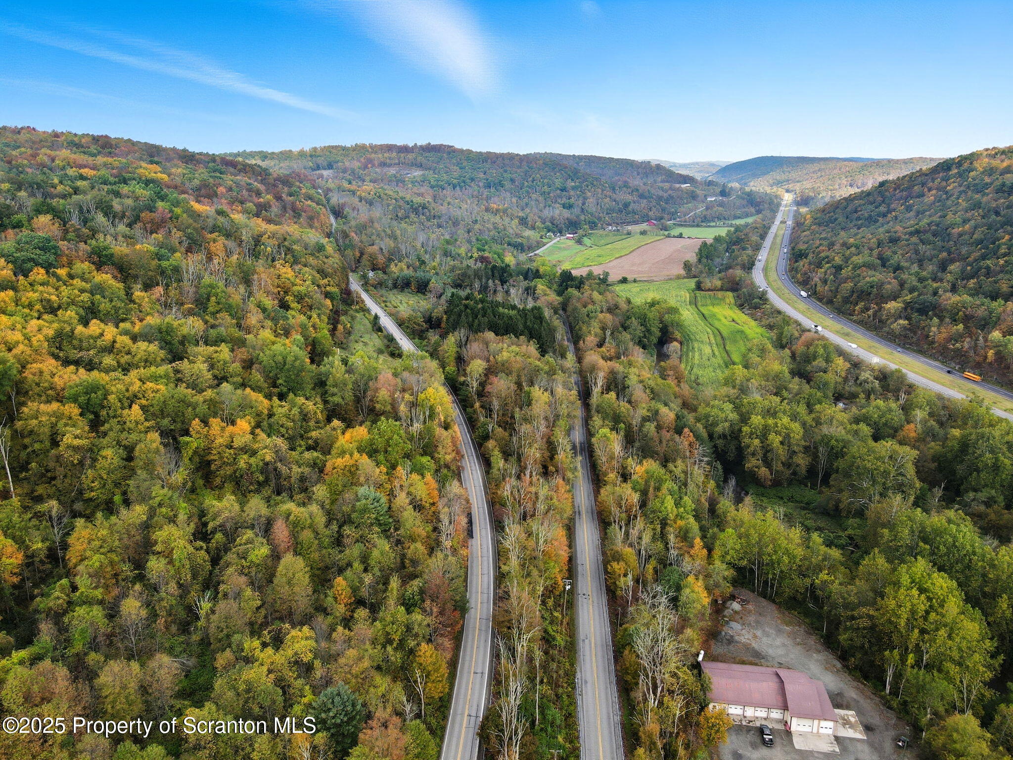 505 Creek Road Kingsley, PA 18826 - Photo 54 of 61 a view of a city with lush green forest