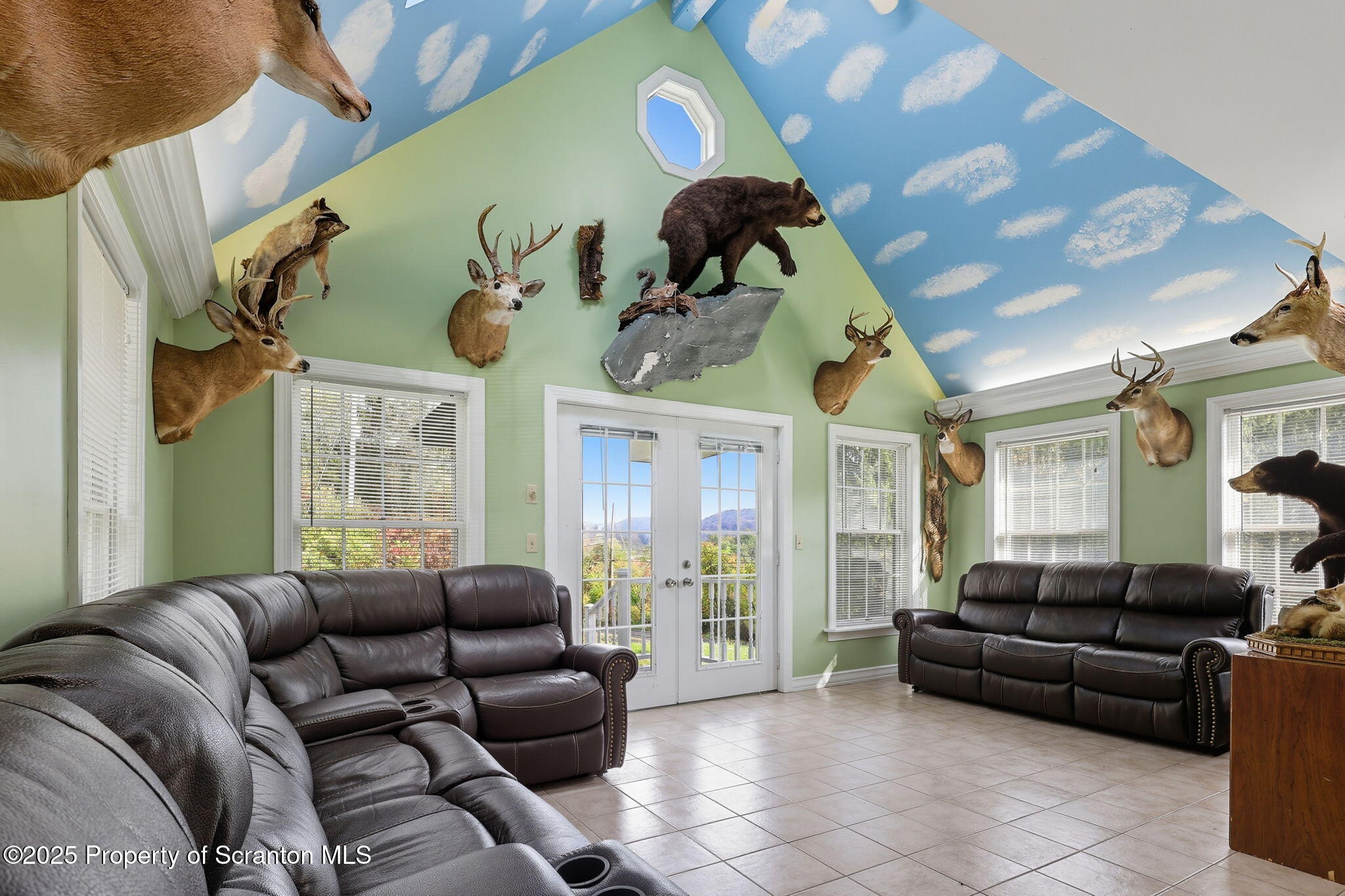 505 Creek Road Kingsley, PA 18826 - Photo 9 of 61 a living room with furniture and a large window