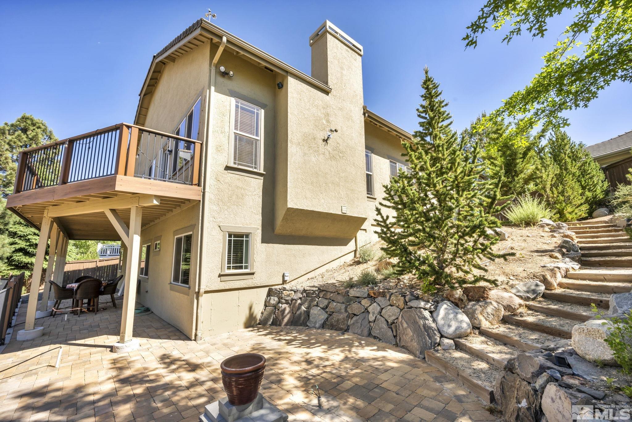 4975 Turning Leaf Way Reno, NV 89519 - Photo 23 of 40 a front view of a house with a yard