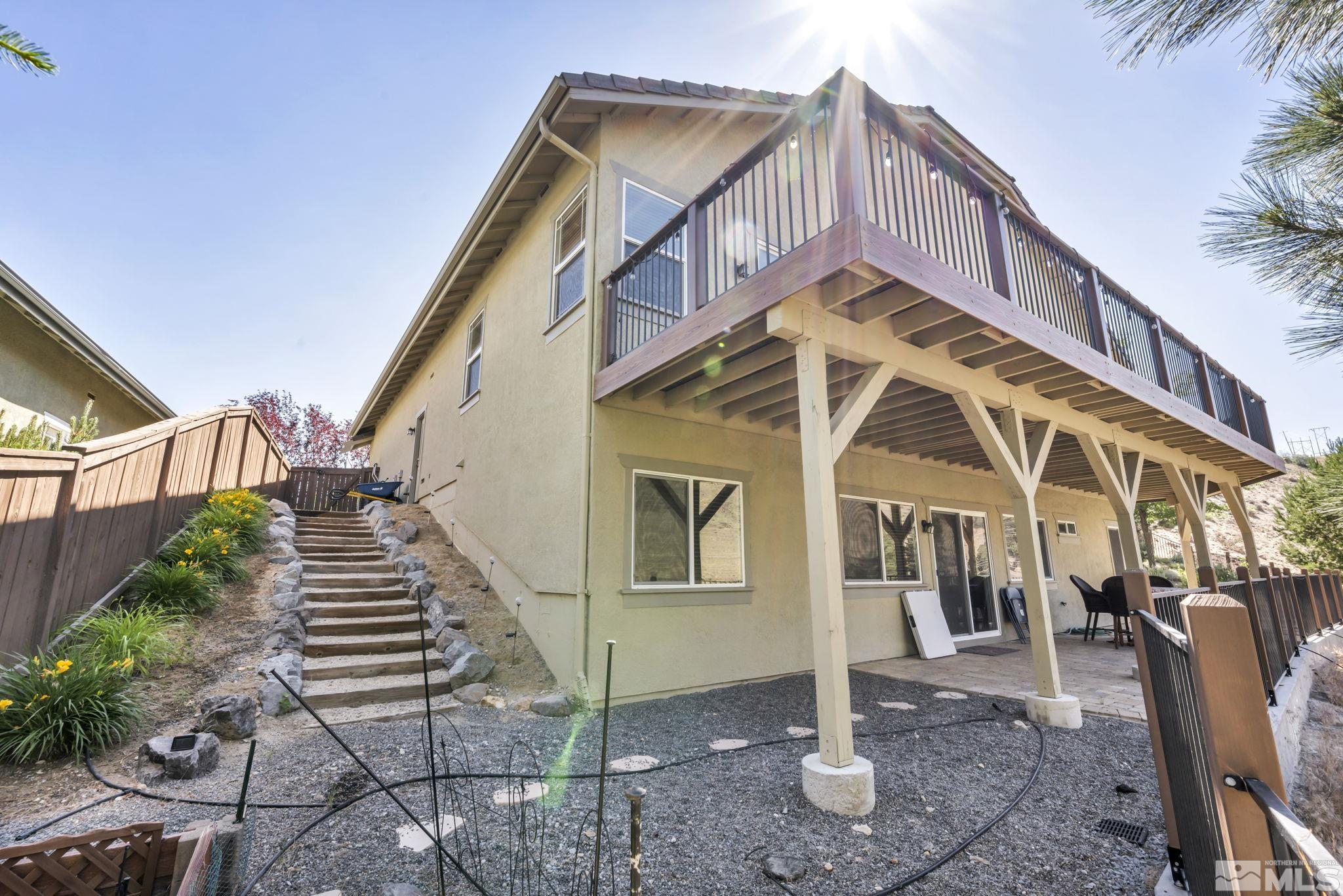 4975 Turning Leaf Way Reno, NV 89519 - Photo 33 of 40 a view of a house with a yard
