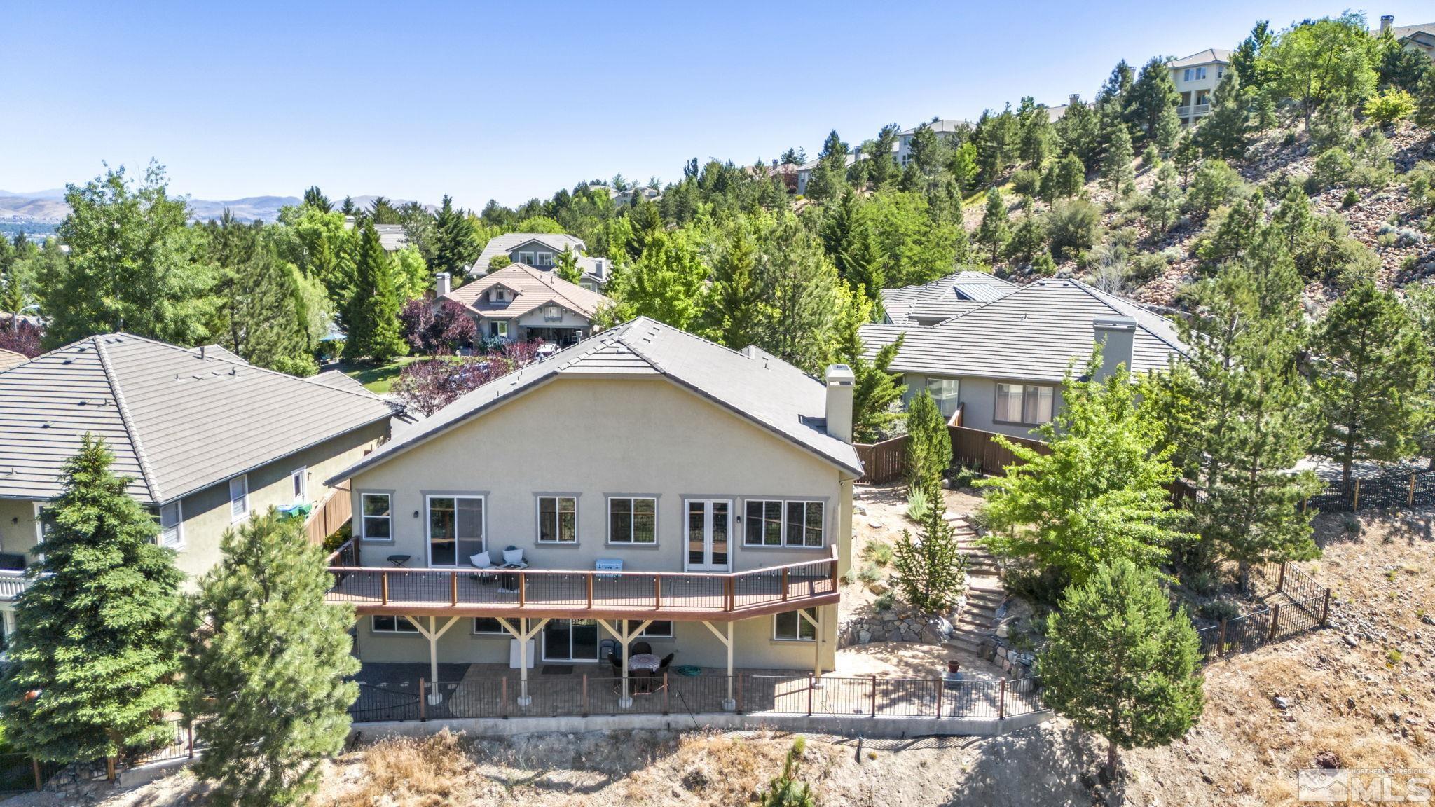 4975 Turning Leaf Way Reno, NV 89519 - Photo 35 of 40 an aerial view of a house with yard porch and furniture