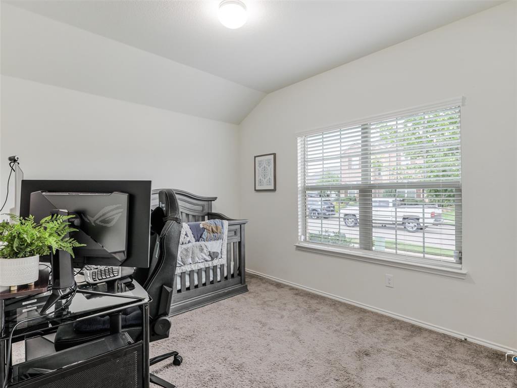 4517 Ashmark Road Aubrey, TX 76227 - Photo 6 of 26 a bedroom with furniture and a window