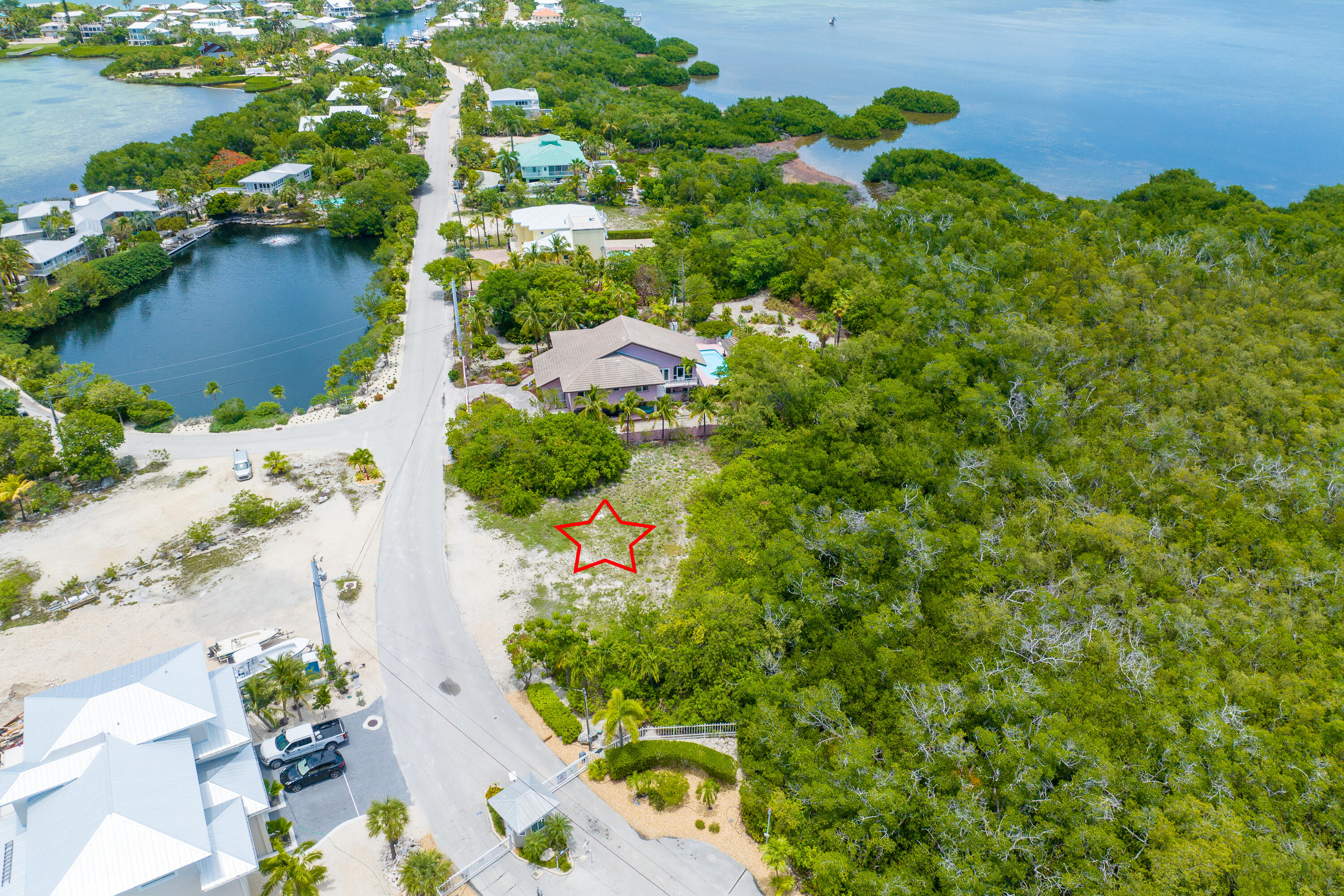 199 Stirrup Key Boulevard Marathon, FL 33050 - Photo 11 of 24 an aerial view of a house with a yard