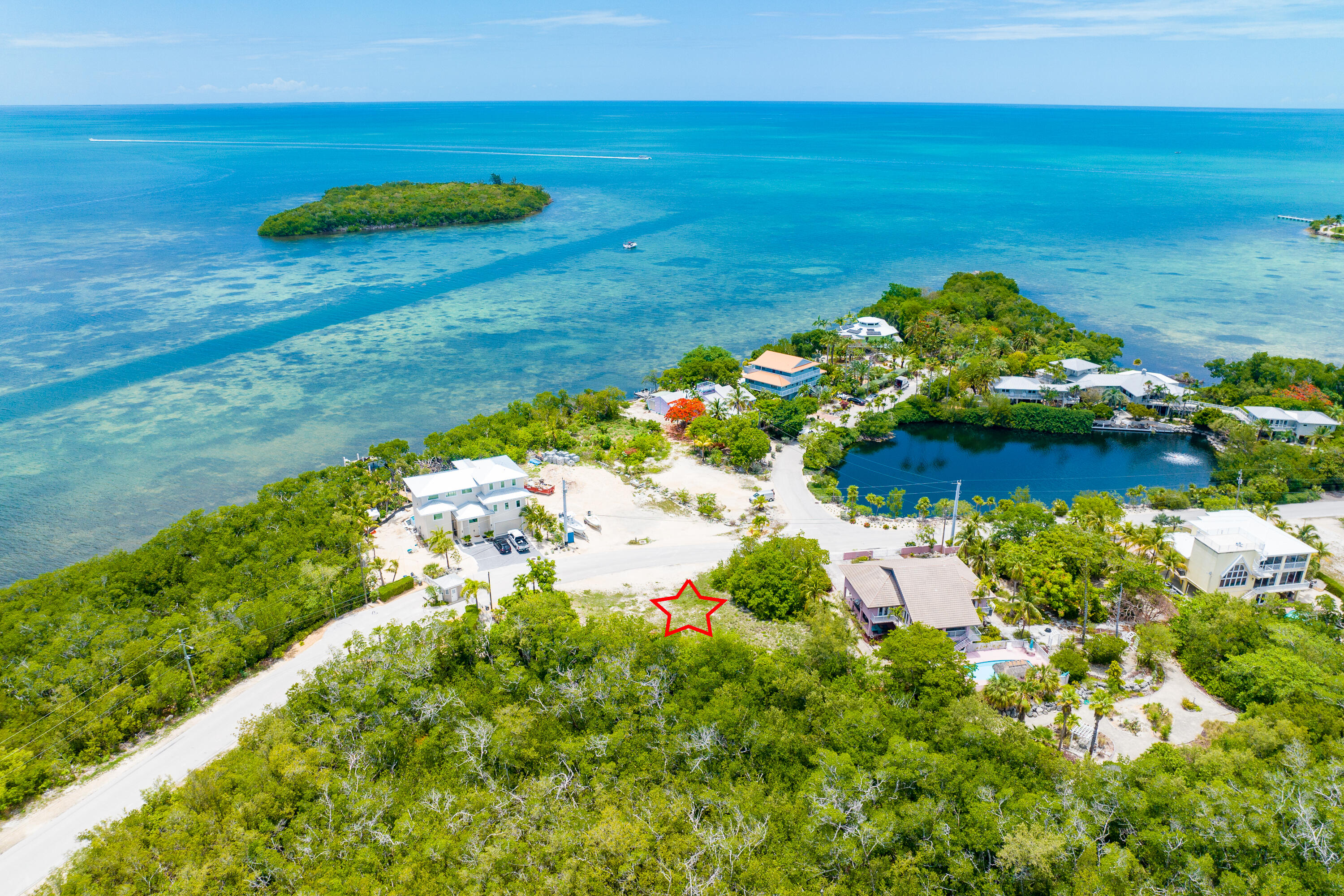 199 Stirrup Key Boulevard Marathon, FL 33050 - Photo 3 of 24 a view of a lake with a yard
