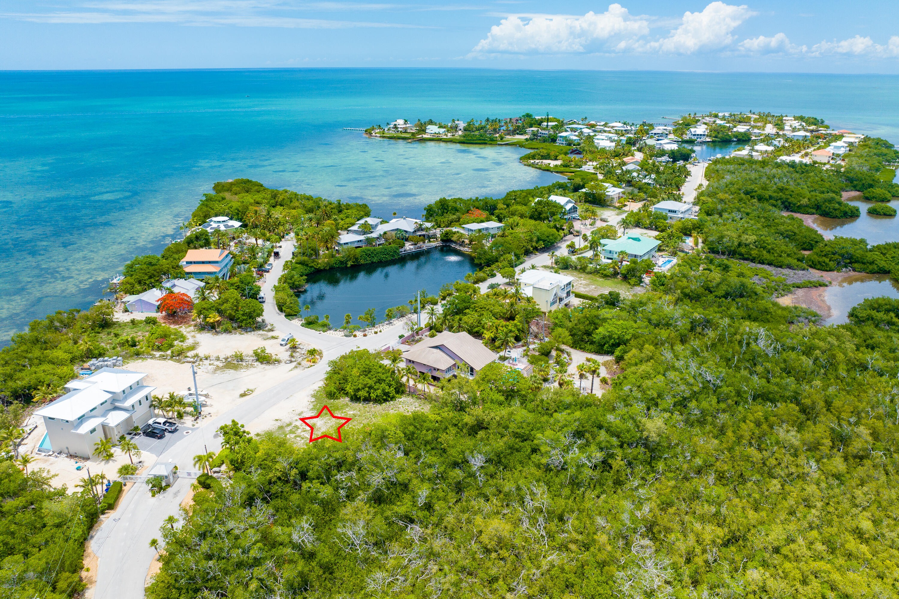 199 Stirrup Key Boulevard Marathon, FL 33050 - Photo 10 of 24 a view of a lake with lawn chairs