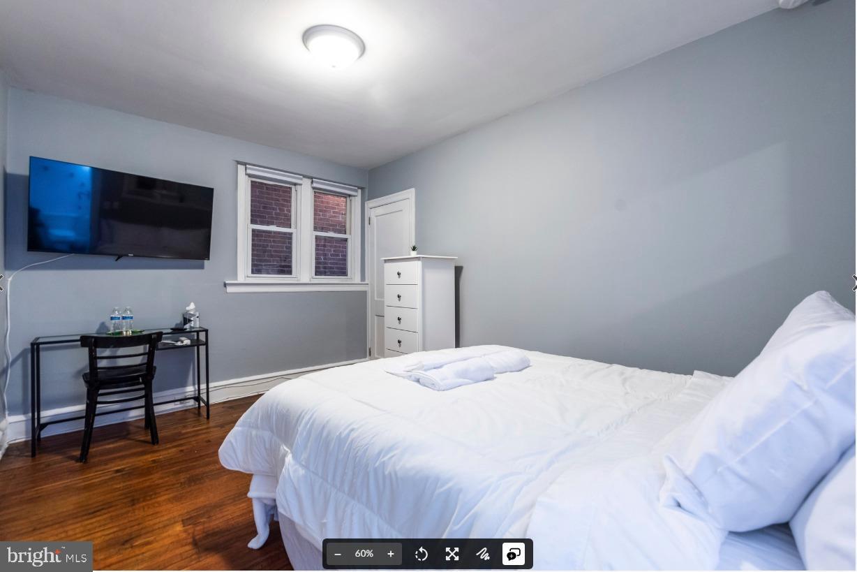 8526 Germantown Avenue, Unit 2 Philadelphia, PA 19118 - Photo 12 of 19 a bedroom with a bed and a television