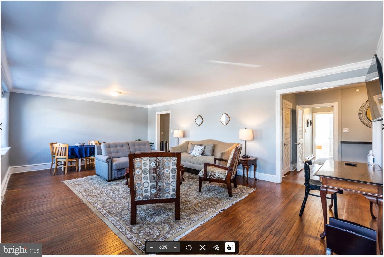 8526 Germantown Avenue, Unit 2 Philadelphia, PA 19118 - Photo 15 of 19 a living room with furniture and a wooden floor