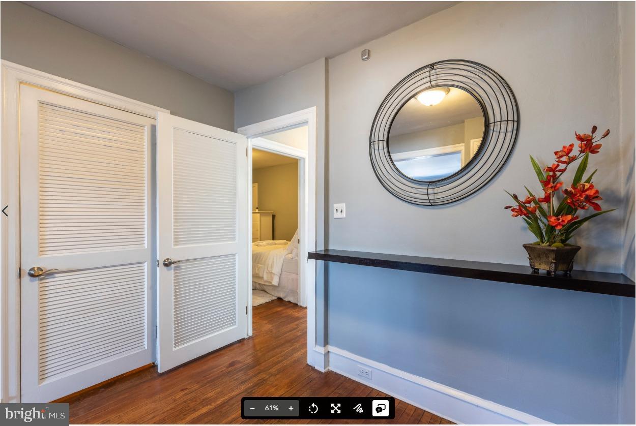 8526 Germantown Avenue, Unit 2 Philadelphia, PA 19118 - Photo 19 of 19 a view of a room with wooden floor and a potted plant