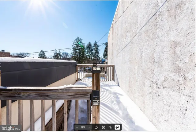 a view of balcony with wooden floor and seating space
