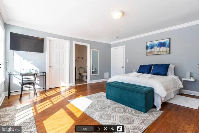 a bedroom with a bed and a walk in closet