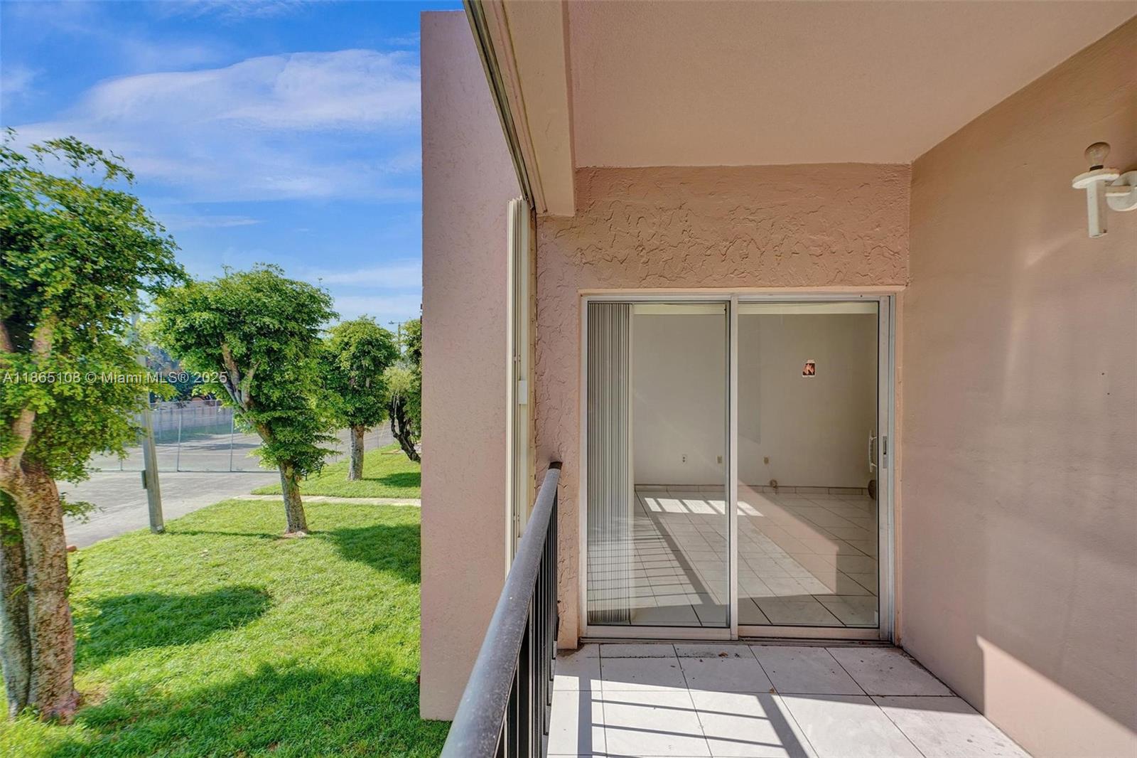 1900 West 68th Street, Unit C203 Hialeah, FL 33014 - Photo 16 of 29 a view of outdoor space
