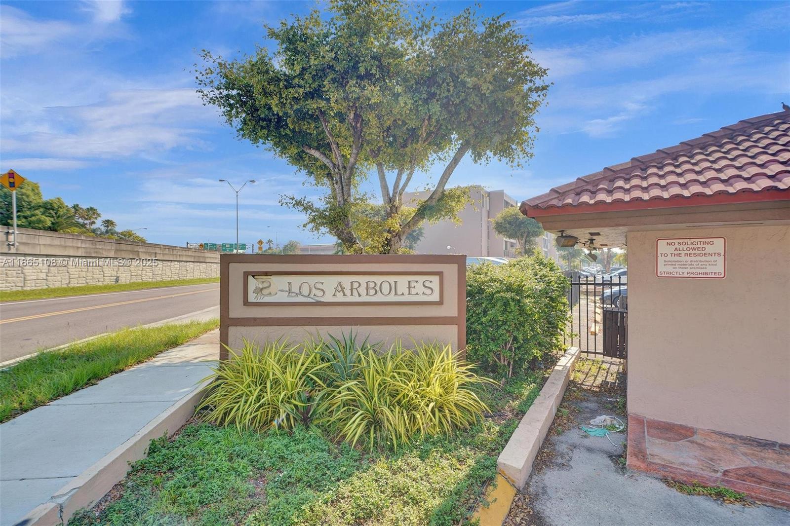 1900 West 68th Street, Unit C203 Hialeah, FL 33014 - Photo 2 of 29 a sign on the side of a building