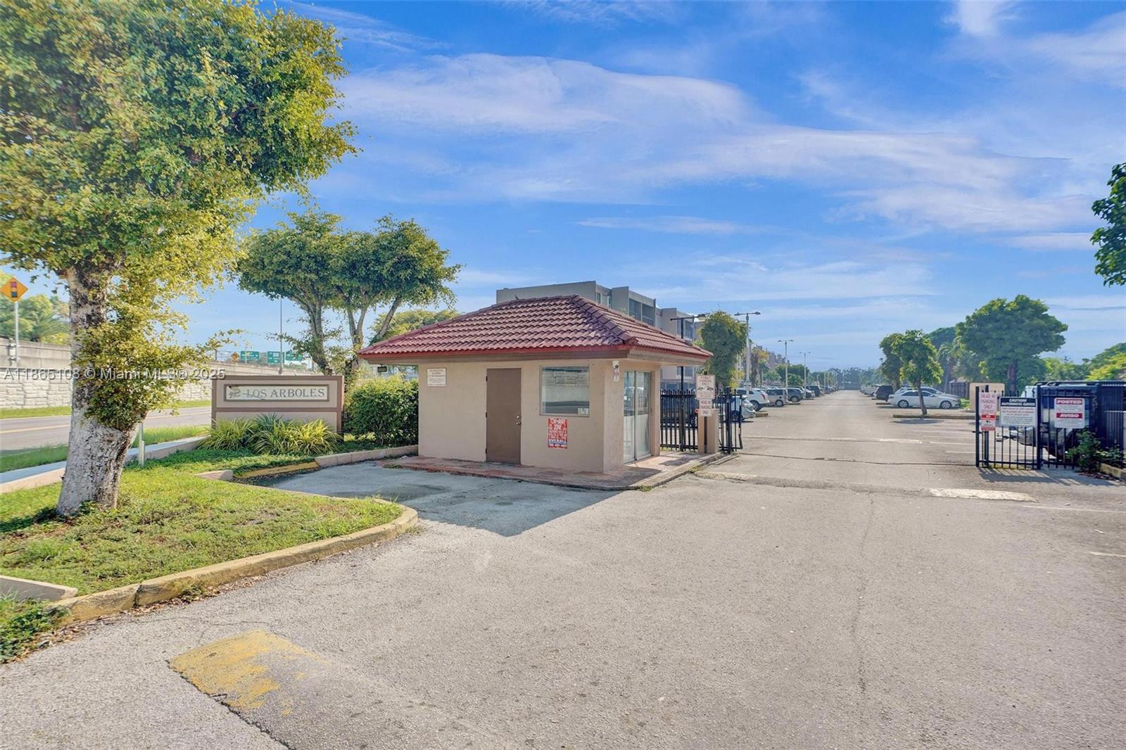 1900 West 68th Street, Unit C203 Hialeah, FL 33014 - Photo 21 of 29 front view of a house with a street