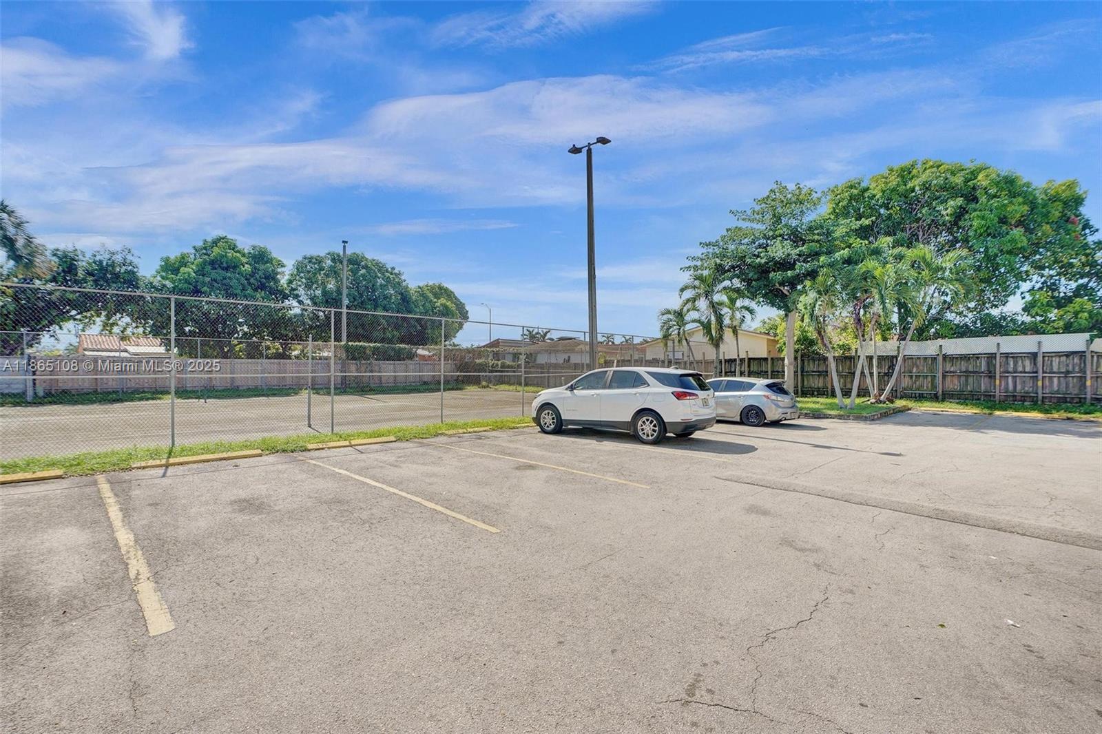 1900 West 68th Street, Unit C203 Hialeah, FL 33014 - Photo 22 of 29 a view of a terrace with a big yard