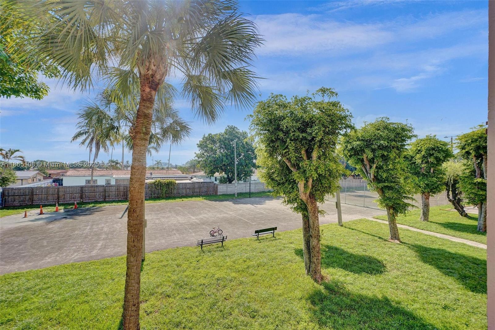 1900 West 68th Street, Unit C203 Hialeah, FL 33014 - Photo 25 of 29 a view of a yard and entertaining space