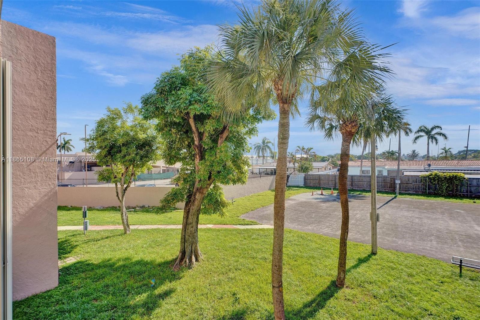 1900 West 68th Street, Unit C203 Hialeah, FL 33014 - Photo 27 of 29 a view of a garden