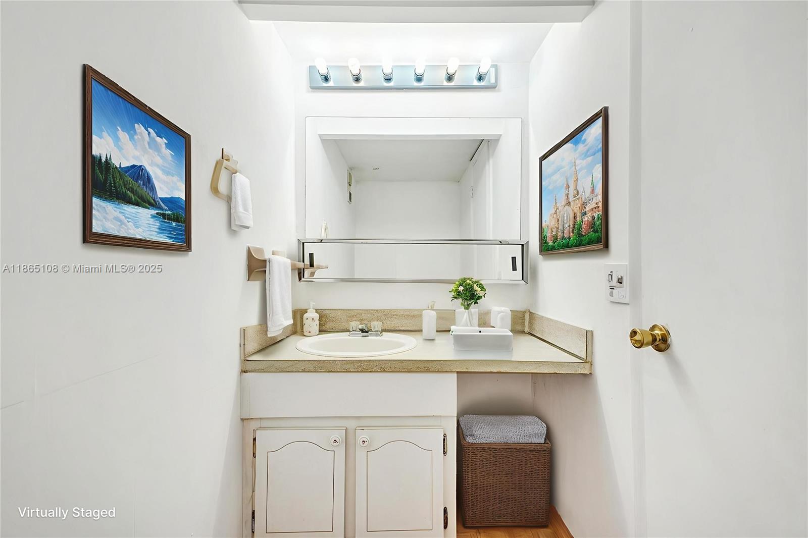 1900 West 68th Street, Unit C203 Hialeah, FL 33014 - Photo 9 of 29 a bathroom with a sink and a mirror