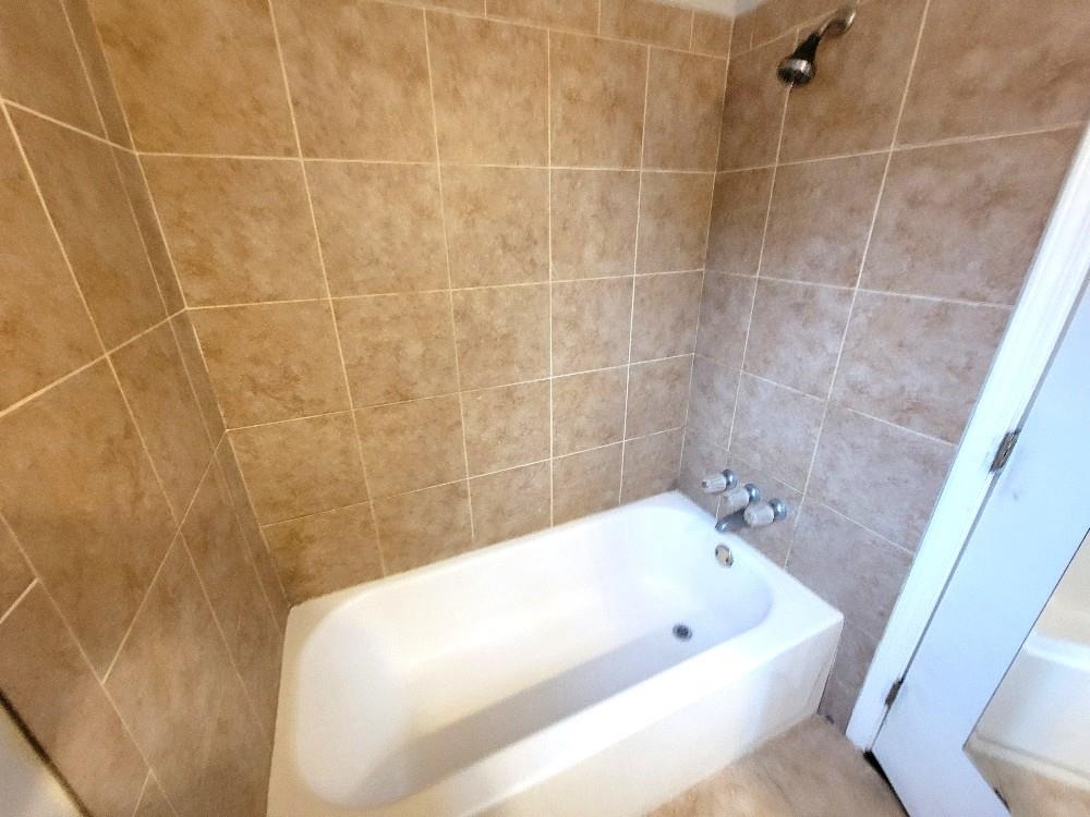 4063 Double Tree Road Memphis, TN 38109 - Photo 13 of 14 Bathroom featuring tiled shower / bath