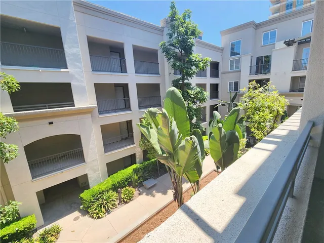 a view of a balcony area with furniture