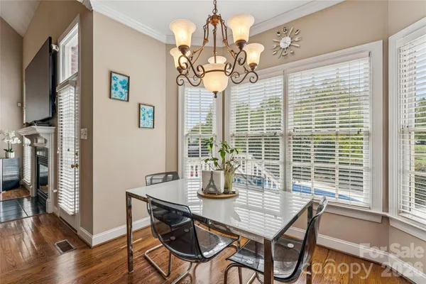 a bedroom with a bed and a flat tv screen on dresser