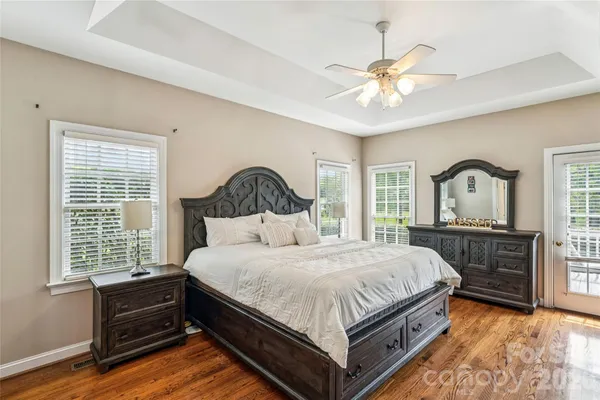 a bathroom with a sink a large mirror and vanity