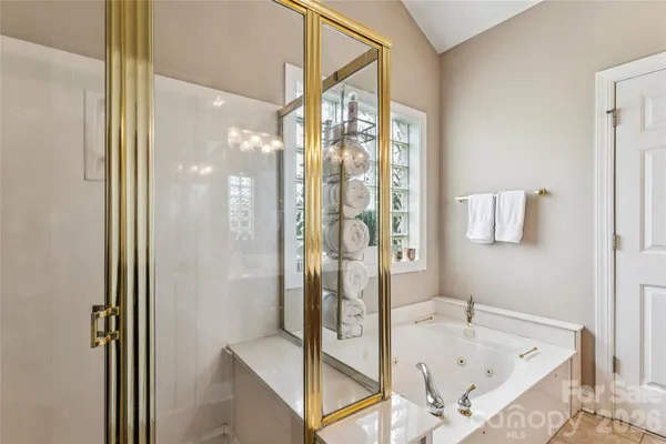 a bathroom with a bathtub and a shower