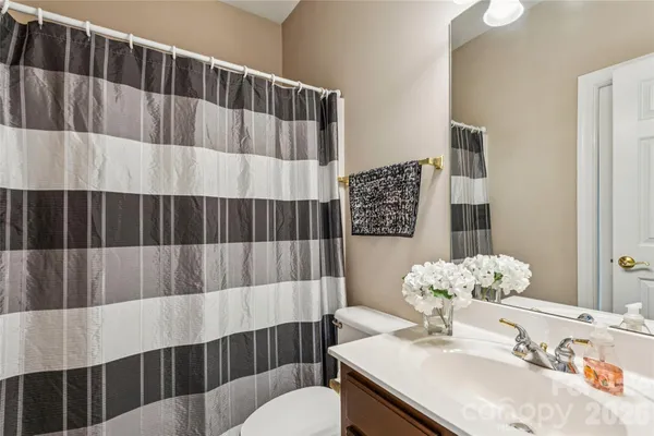 a kitchen with a stove a sink and a microwave