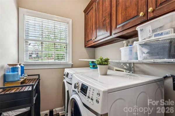 a view of entryway with wooden floor and stairs
