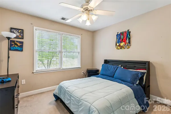 a living room with a bed and a couch