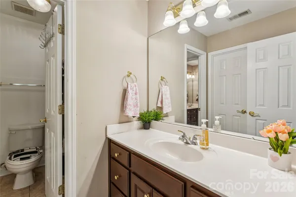 a bathroom with a sink double vanity and a mirror