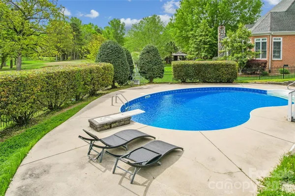 a balcony with wooden floor and fence