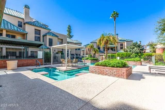 a view of a house with sitting area and garden