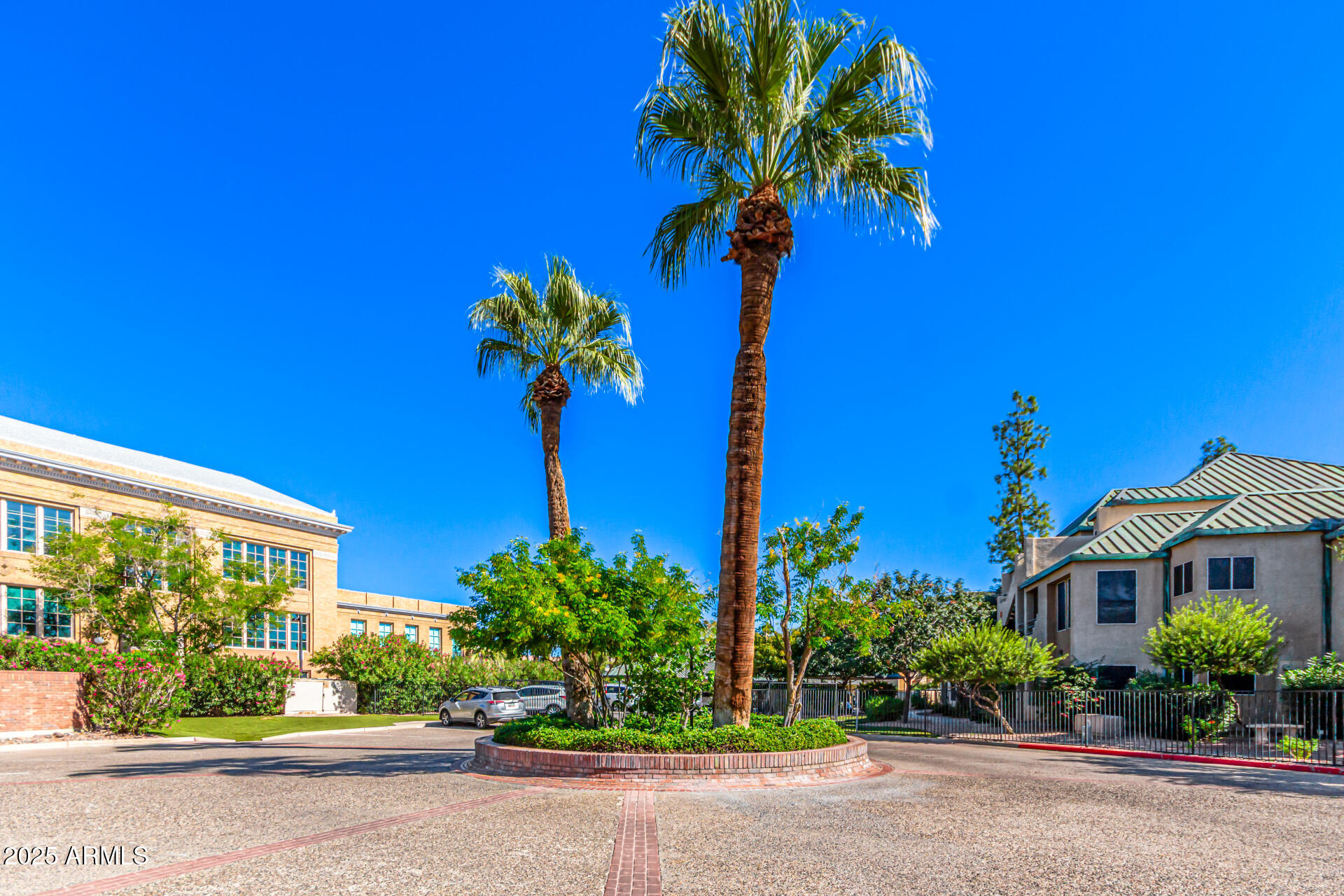 101 North 7th Street, Unit 135 Phoenix, AZ 85034 - Photo 27 of 33 a flower is in front of a brick building