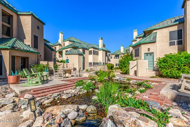 a front view of a house with fountain bath tub and barbeque oven