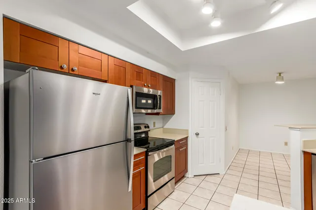 a white refrigerator freezer sitting inside of a kitchen
