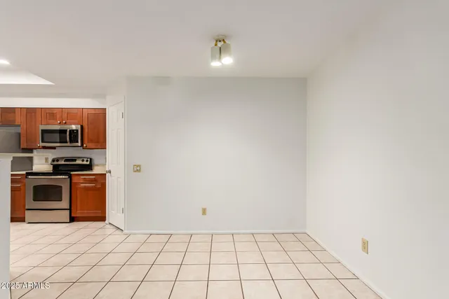 a view of a kitchen with microwave and cabinets