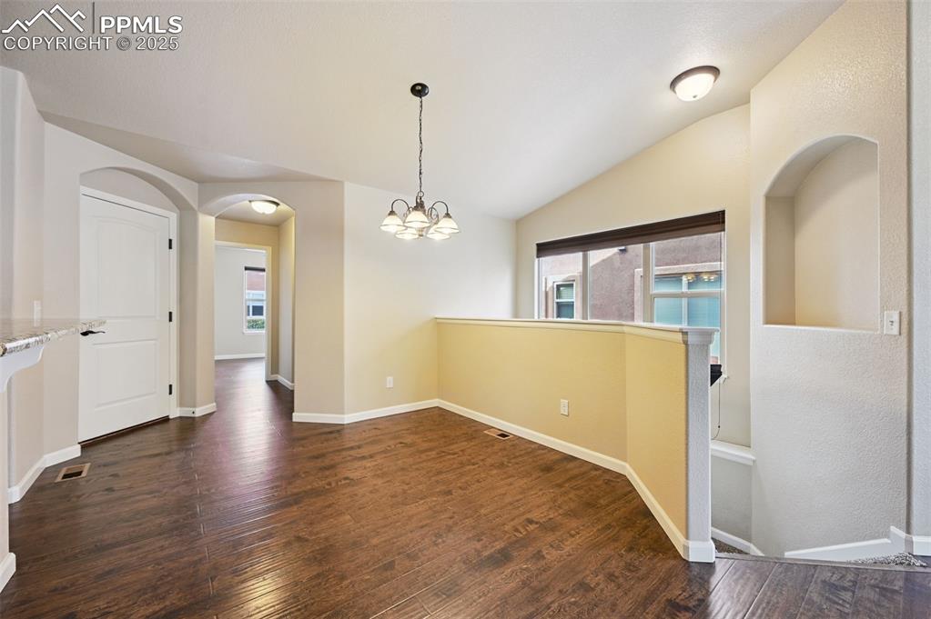 5384 Oak Spring Heights Colorado Springs, CO 80923 - Photo 11 of 19 a view of empty room with wooden floor