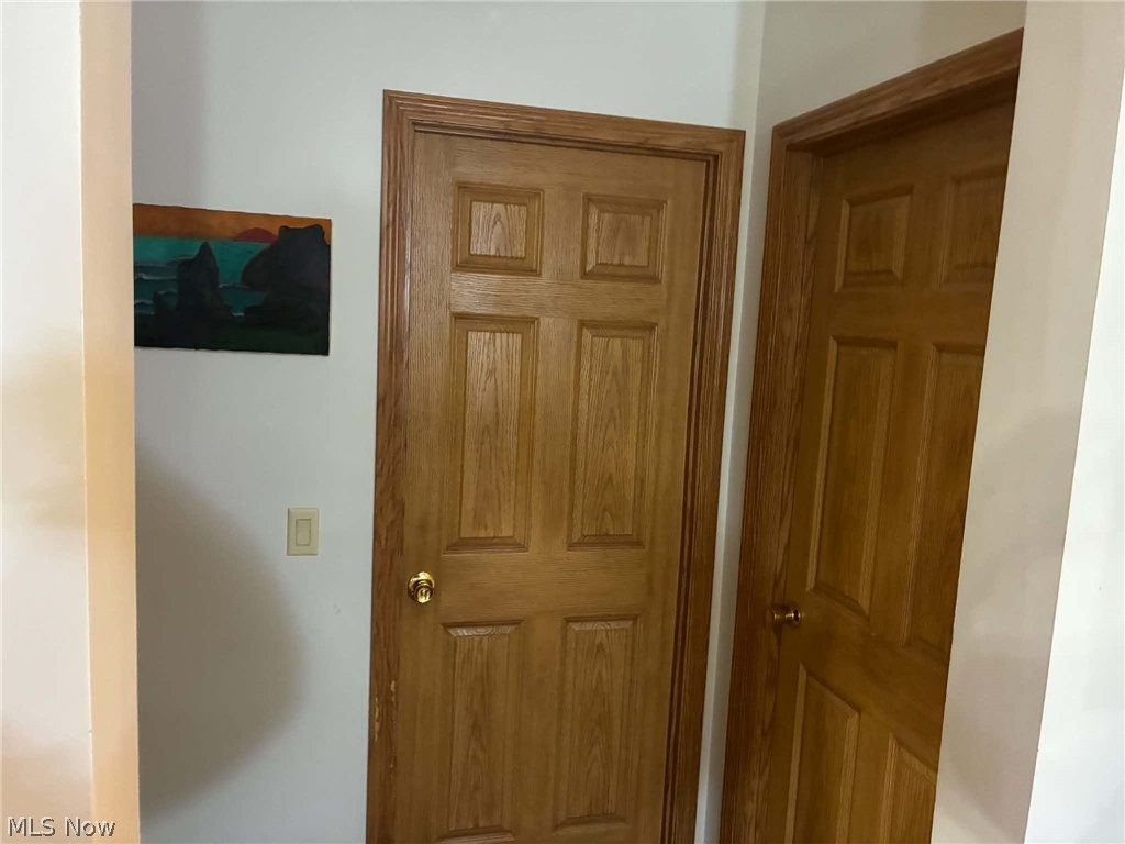 4601 Bessemer Road Nelsonville, OH 45764 - Photo 14 of 25 Wood-finish paneled doors with gold-tone hardware