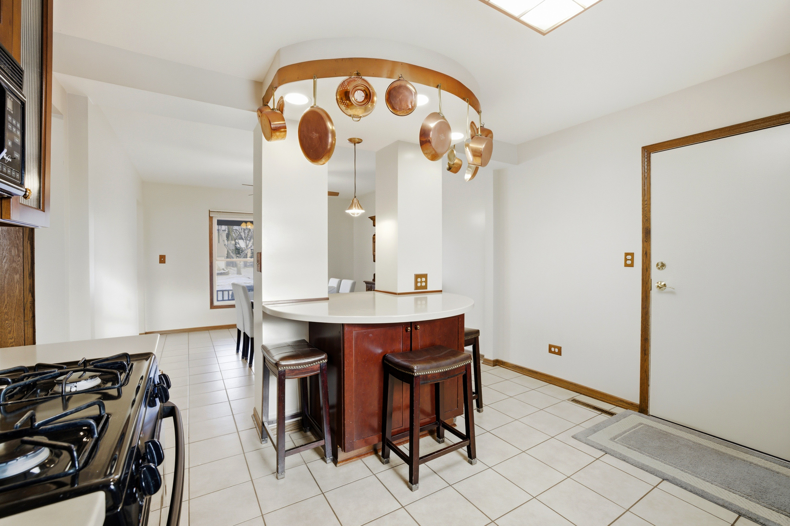 220 Dato Drive Streamwood, IL 60107 - Photo 13 of 36 a view of kitchen island with furniture and wooden floor
